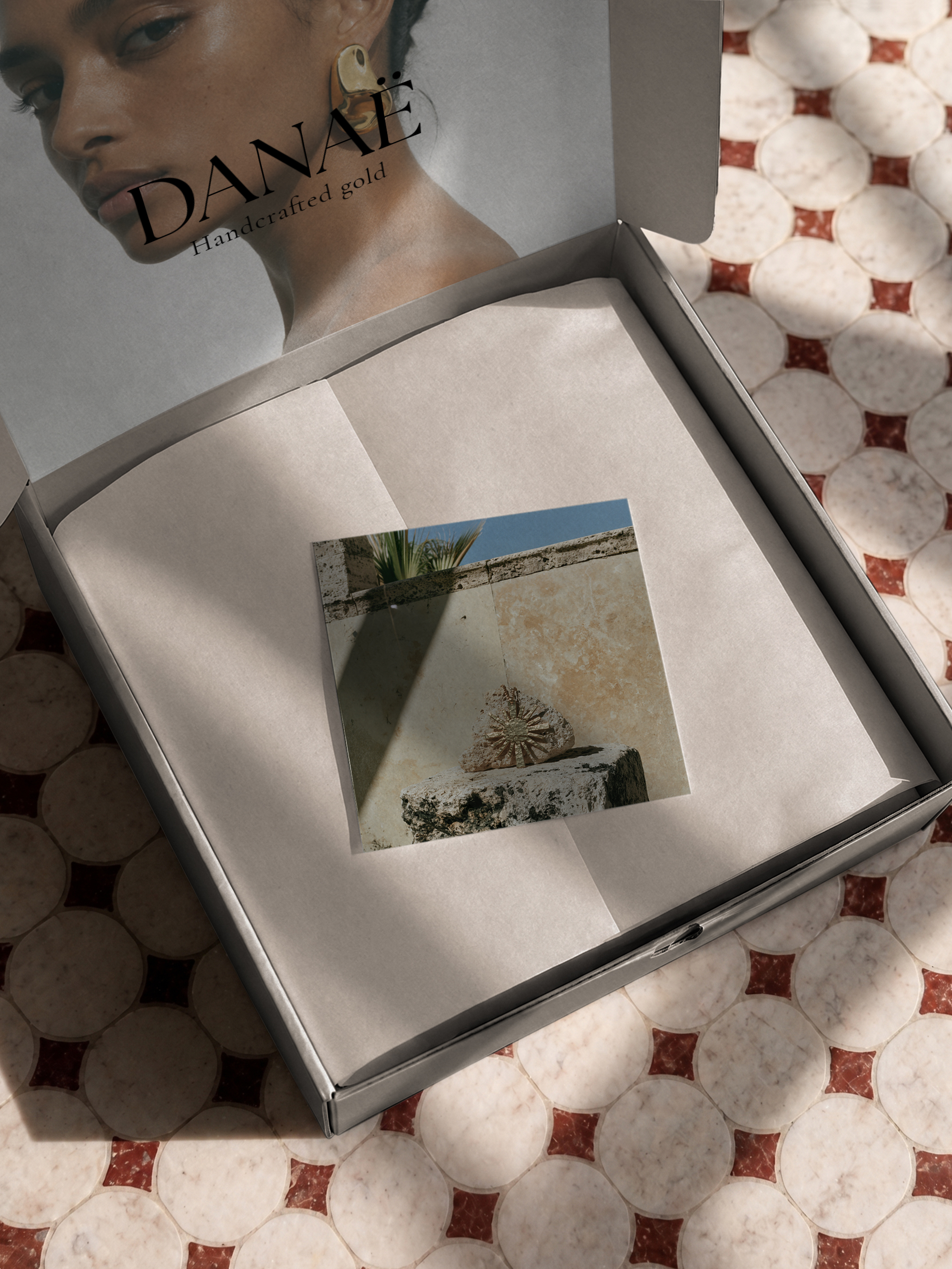 DANAË packaging — gift box with brand card